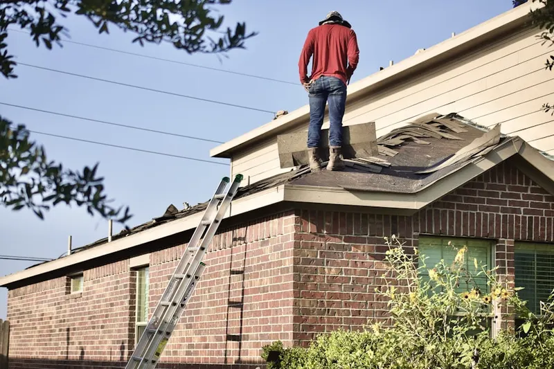 Professional roofer working on a residential roof in Nevada Street